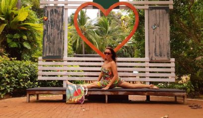 yoga split on a tropical background